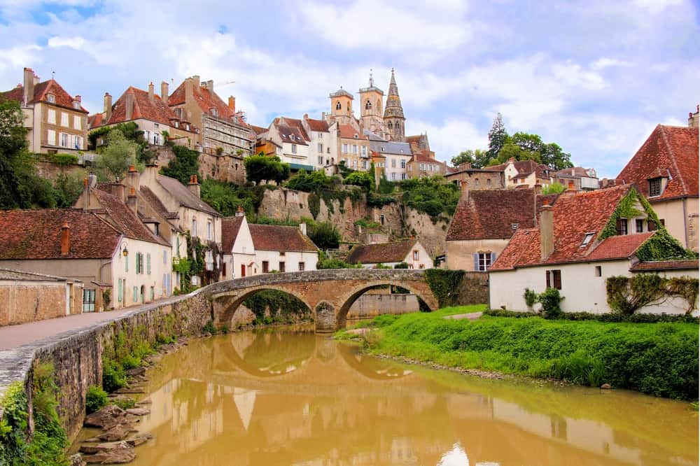 The Quaint river running through the medieval town of Semur-en-Auxois in Burgundy, France.
