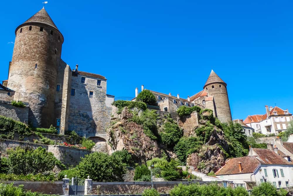 Castle towers on a cliff side in the Burgunda town of Semur en Auxois in France.