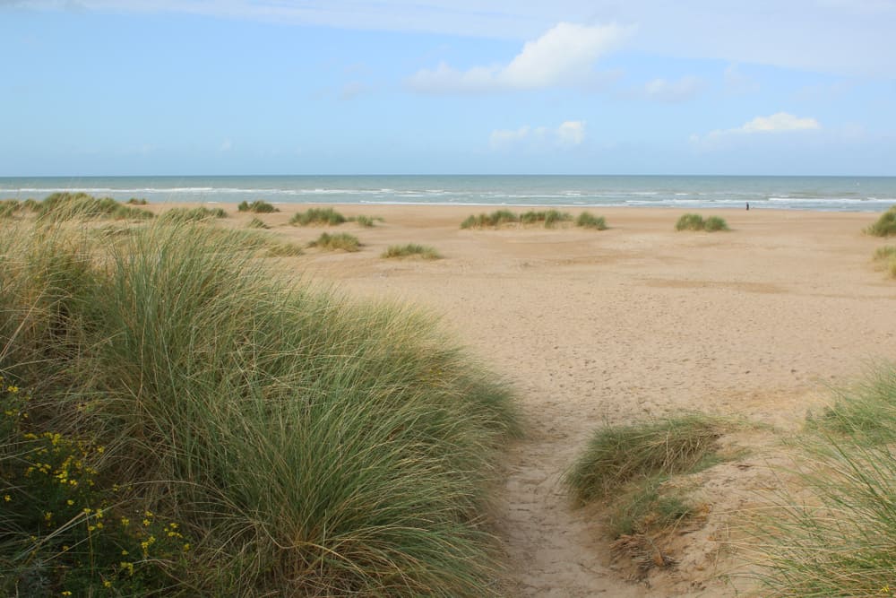 Nice sandy beach and ocean in Côte Fleurie in Normandy, France.