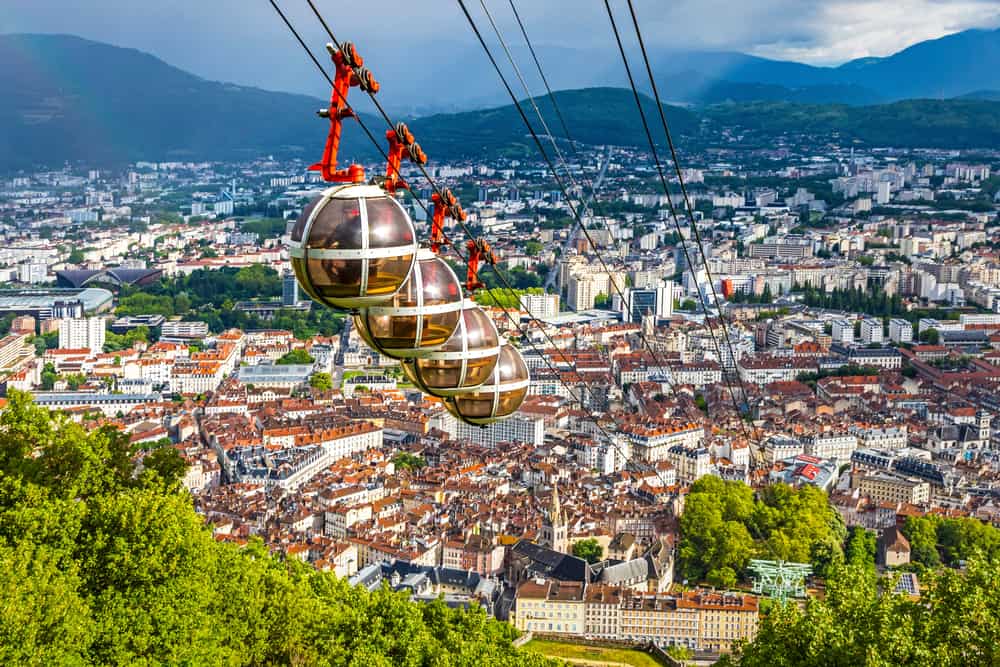 Cable cars traveling over Grenoble in the French Alps.