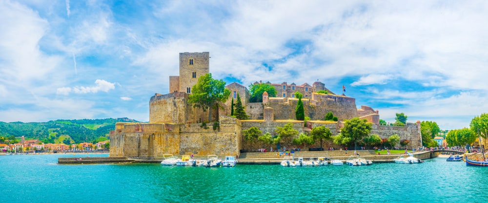The Castle of Collioure in France seen from the water side on a bright day.
