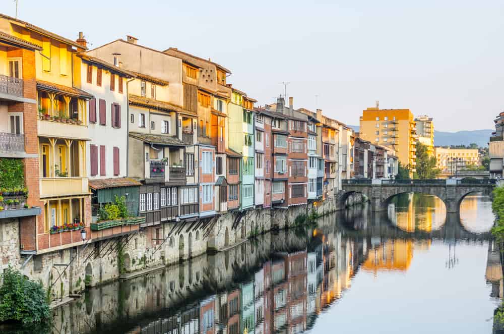 Old houses facing the river running through Castres in Languedoc-Roussillon.