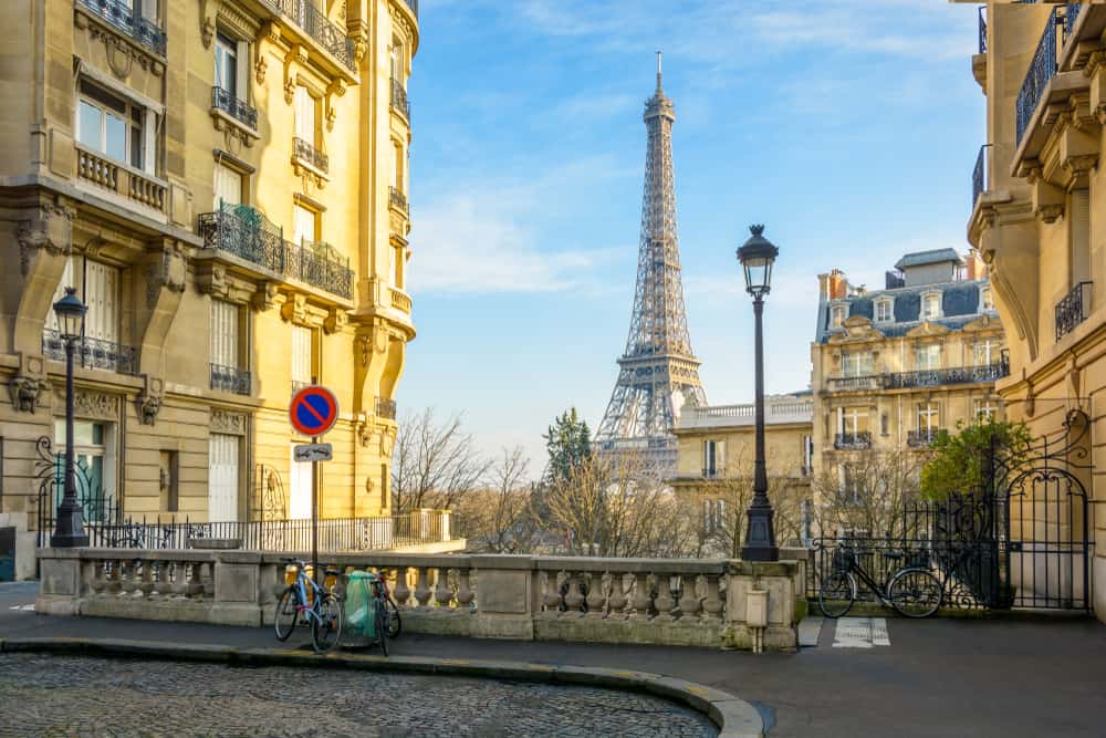 Street view from the Chaillot Quarter in Paris, France. Typical Parisian street with the Eiffel Tower in the background.