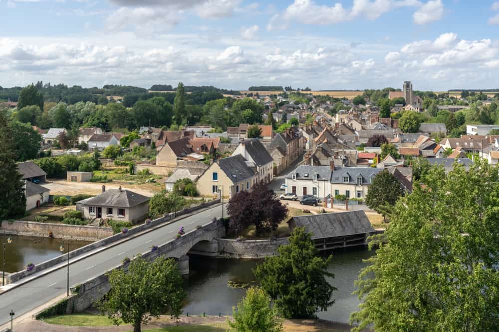 Aerial view of Chateaudun in Loire Valley, France. River, bridge, roofs of authentic cozy houses.