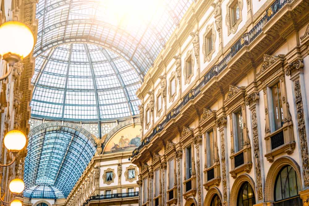 Looking up the majestic glass dome of Galleria Vittorio Emanuele in Milan, Italy.