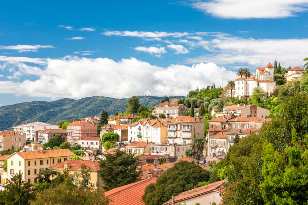 Panoramic view of Grasse in France with mountains in the background.