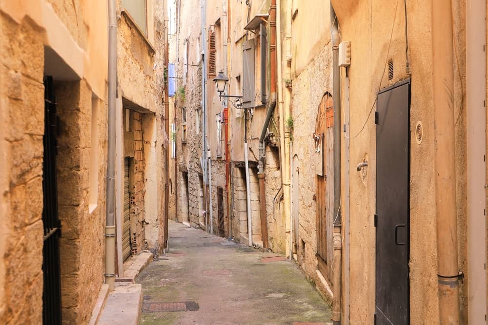 Narrow street in the old town of Grasse, France.