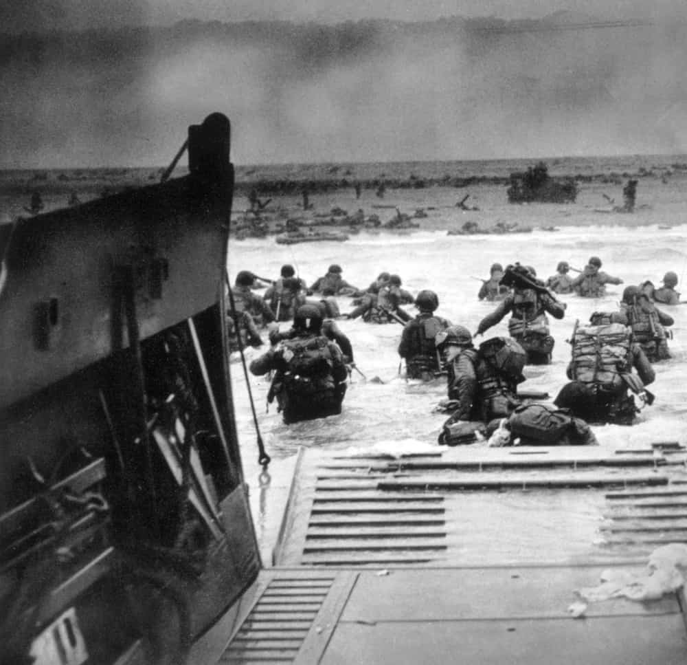 American soldiers invading Omaha Beach in Normandy on D-Day 1944.