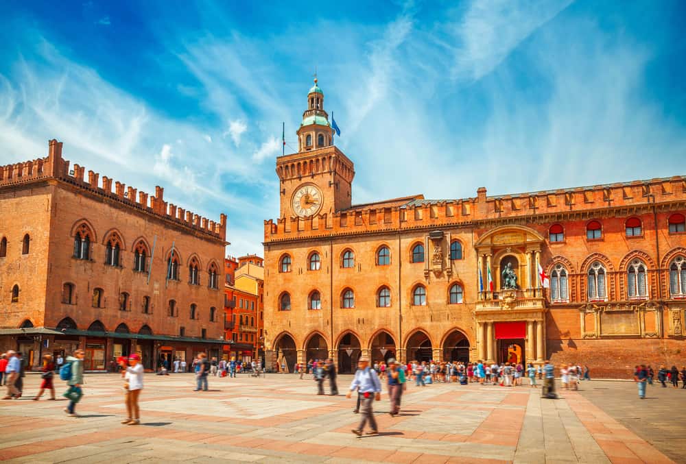 Piazza Maggiore in Bologna in Italy on a clear blue day. Lots of tourists.