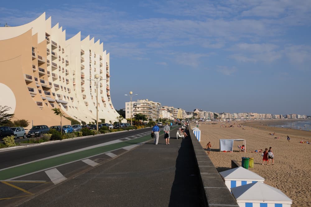 Beach promenade in La Baule, France. Hotels on one side of the promenade and the beach to the other side.
