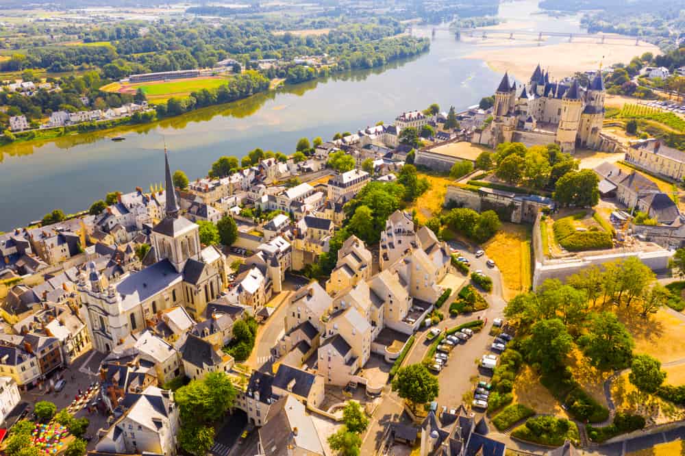 Aerial view of Saumur in Loire Valley, France. The citys medieval castle and the Loire river.