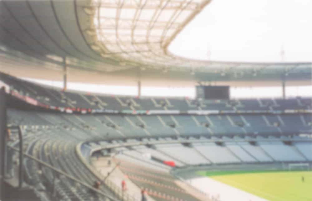 Blurred image of Stade de France in St. Denis.