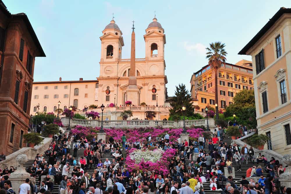 The Spanish Steps in Rome crowded with people.