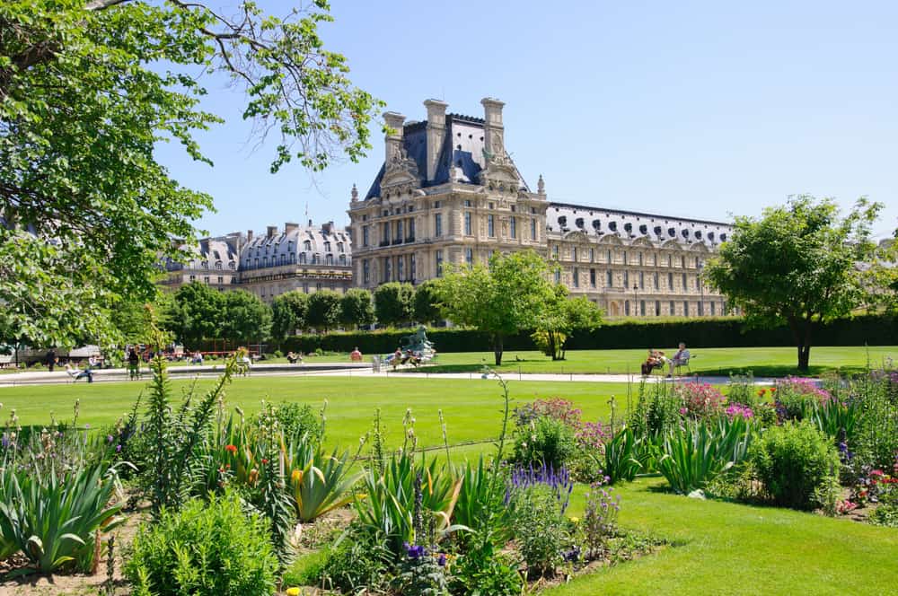 Tuileries Garden in Paris with a large castle in the back.