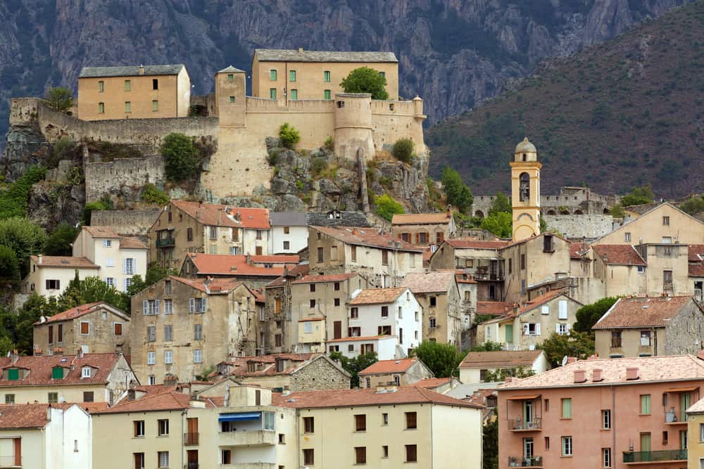 Buildings on a hill in the mountain village of Corte in Corsica, France.