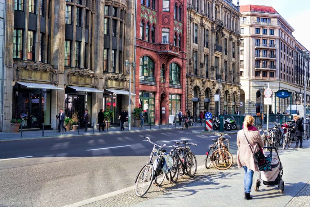 Friedrichstrasse in Berlin, Germany. With bicycles, pedestrians, and tall buildings.
