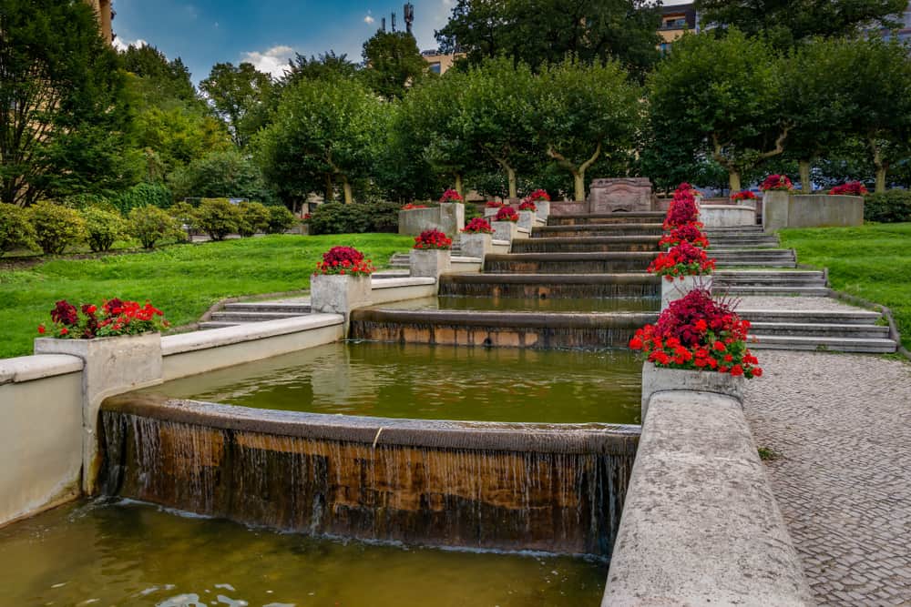 Water monument and flowers in Lietzenseepark in the Berlin-Charlottenburg district.