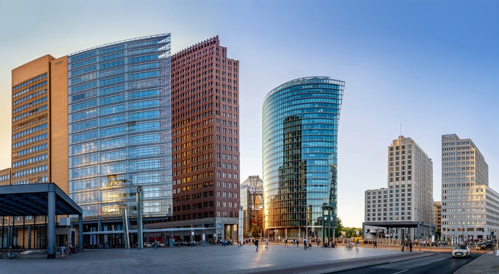 Panoramic view of Potsdamer Platz in Berlin with its many tall buildings made of steel, glass, and concrete.