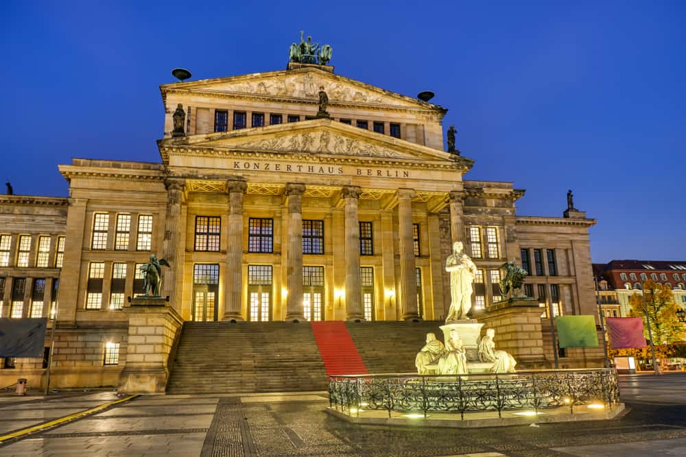 The Konzerthaus in Berlin at the Gendarmenmarkt. Outside view at night with lights on.