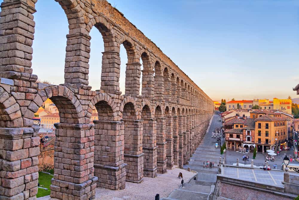 The famous ancient Roman aqueduct on Plaza del Azoguejo square in Segovia, Spain.