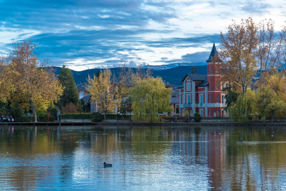 Panoramic view of Puigcerdà Lake with the town of Puigcerdà, Spain in the background.