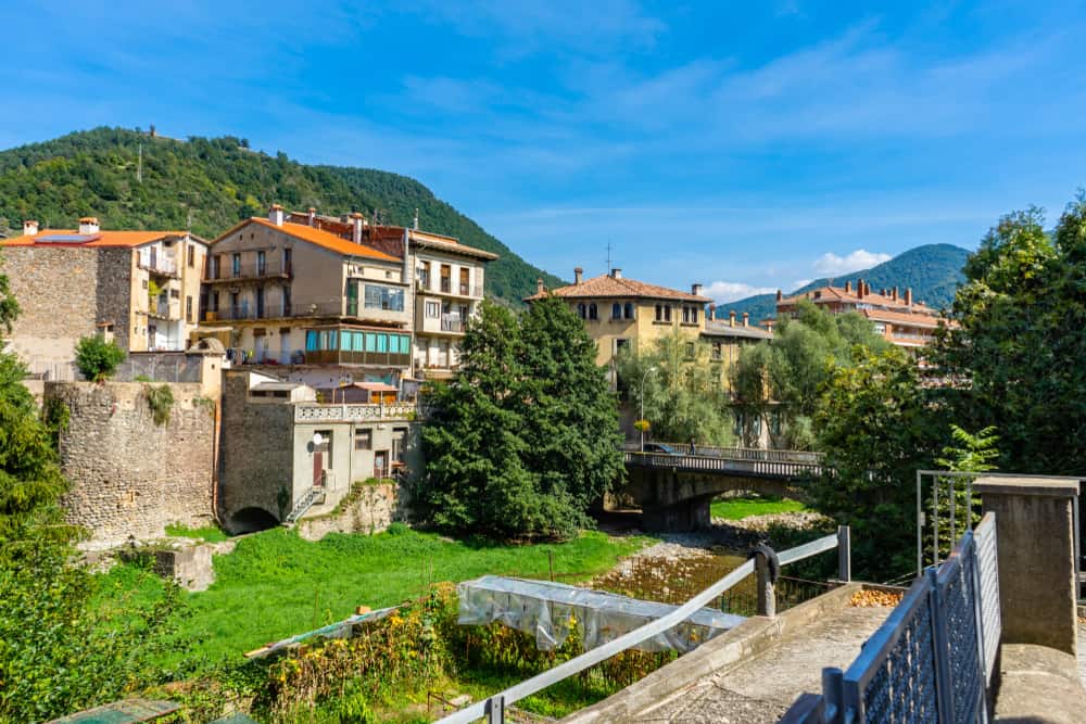 Panoramic view of houses and gardens in Ripoll, Spain.