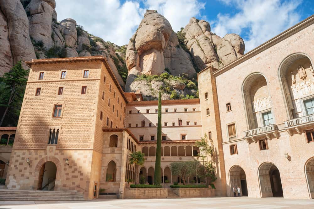 An outside view of the Monastery of Montserrat (Santa Maria de Montserrat) in the mountains near Barcelona in Spain.